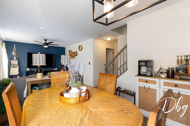 254 Spring Valley Way, Round Lake, IL 60073 - dining space with ceiling fan with notable chandelier and stairs