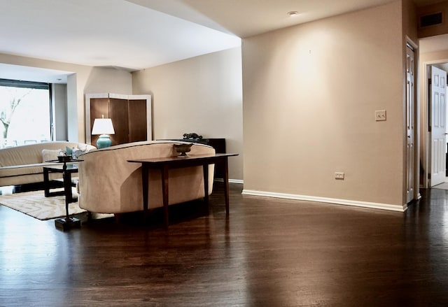 interior space featuring wood finished floors, visible vents, and baseboards