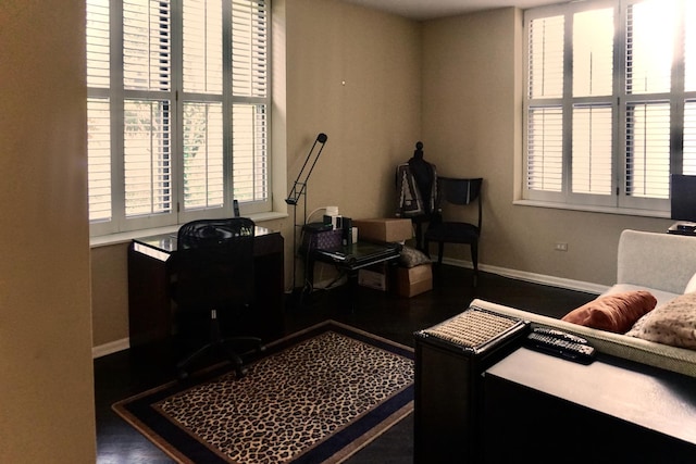 office space with baseboards