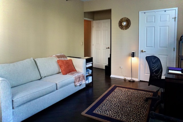 living area with wood finished floors and baseboards