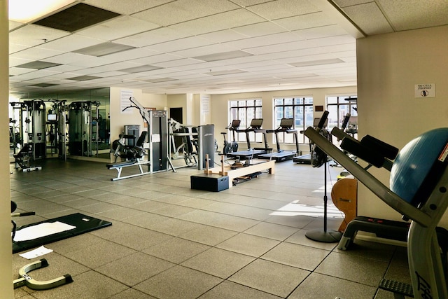 exercise room featuring a drop ceiling and visible vents