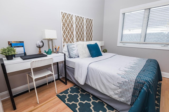 bedroom with wood finished floors