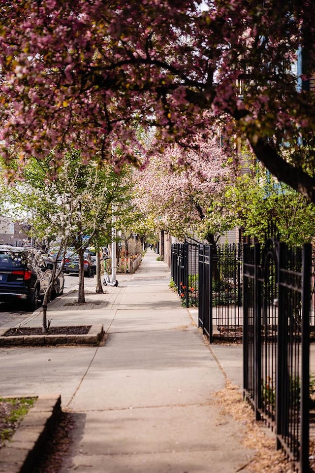 surrounding community with a gate and fence