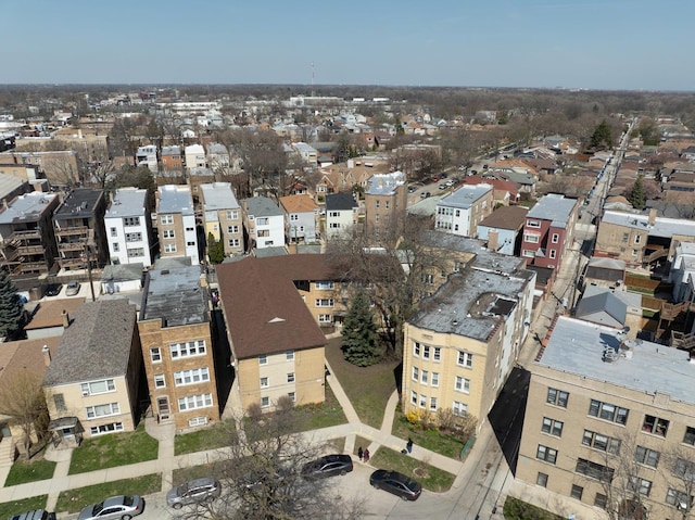 birds eye view of property with a view of city