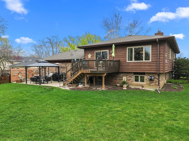 back of house with a patio, a wooden deck, a lawn, a chimney, and a gazebo