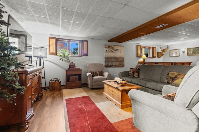 living area featuring visible vents and a wealth of natural light