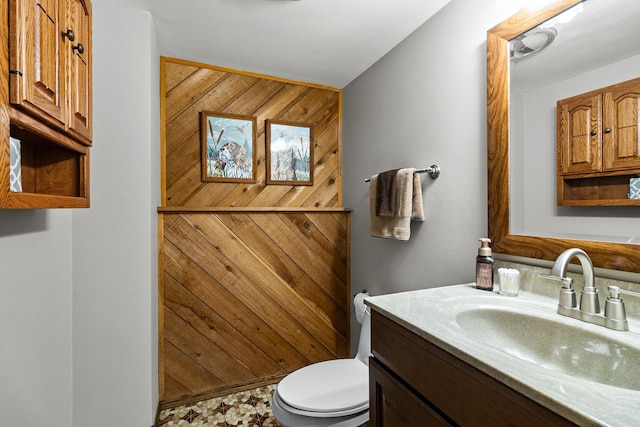 bathroom featuring toilet and vanity