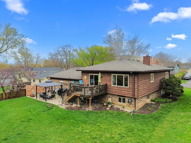 back of house with a chimney, fence, a gazebo, a patio, and a wooden deck