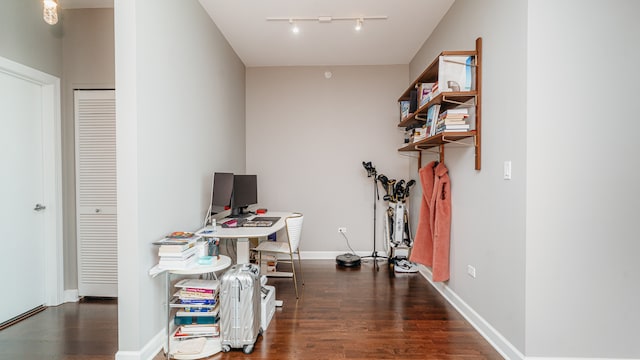 home office with track lighting, dark wood-style floors, and baseboards