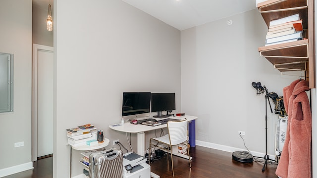 home office with dark wood-type flooring and baseboards
