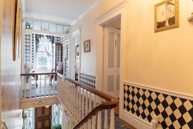 105 S High St, Galena, IL 61036 - corridor featuring crown molding, plenty of natural light, and a wainscoted wall