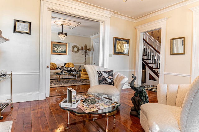 105 S High St, Galena, IL 61036 - sitting room featuring stairs, ornamental molding, dark wood finished floors, baseboards, and a notable chandelier