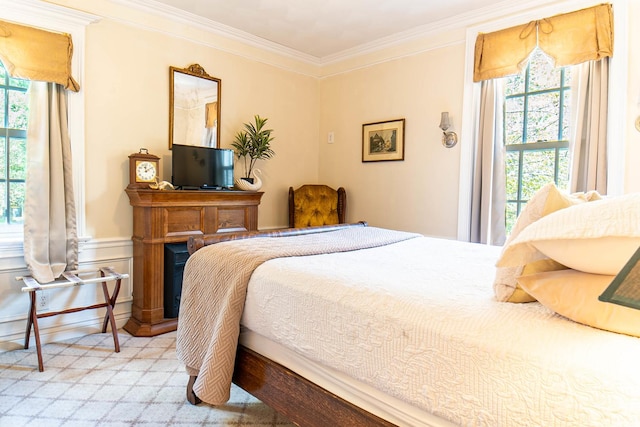 105 S High St, Galena, IL 61036 - bedroom featuring a fireplace, carpet, crown molding, and multiple windows