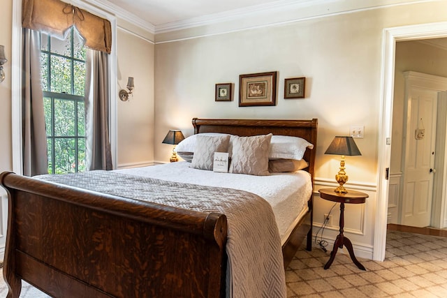 105 S High St, Galena, IL 61036 - bedroom with light carpet, ornamental molding, and baseboards