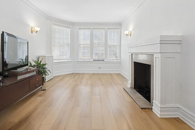 1225 W Lunt Ave Unit 2B, Chicago, IL 60626 - living room with a tiled fireplace, light wood finished floors, and crown molding