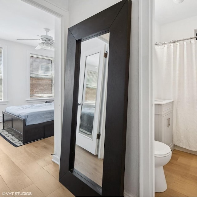 1225 W Lunt Ave Unit 2B, Chicago, IL 60626 - full bathroom featuring wood finished floors, plenty of natural light, a ceiling fan, and ensuite bath