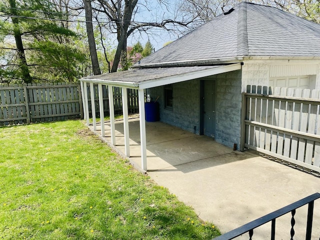 view of side of property featuring a yard, a shingled roof, and fence