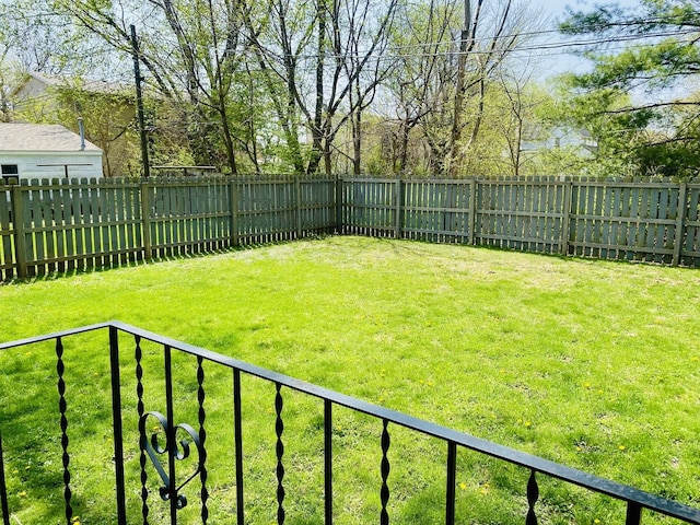 view of yard with a fenced backyard