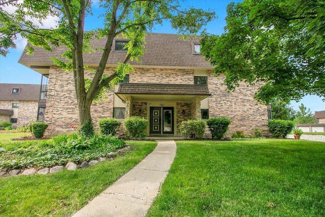 9178 S Rd E Unit D, Palos Hills, IL 60465 - view of front of property with a front yard and brick siding