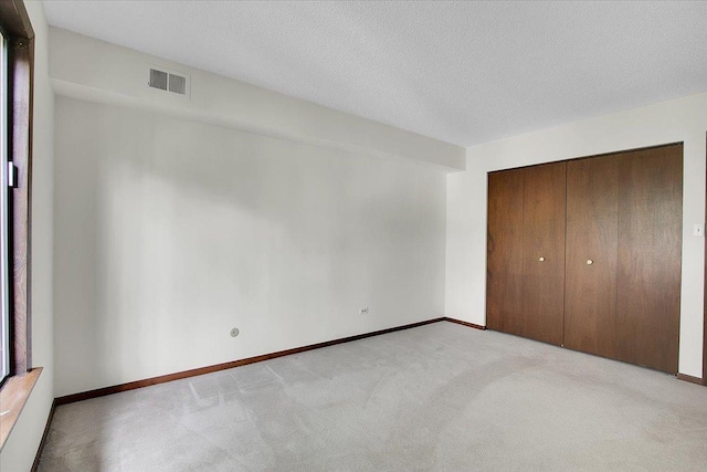 9178 S Rd E Unit D, Palos Hills, IL 60465 - unfurnished bedroom with light colored carpet and a closet