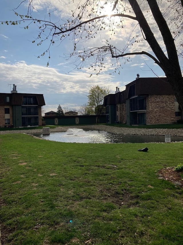 9178 S Rd E Unit D, Palos Hills, IL 60465 - view of green lawn featuring a water view