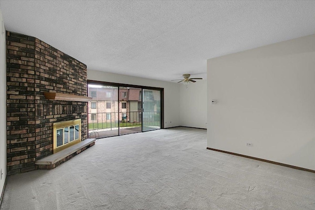 9178 S Rd E Unit D, Palos Hills, IL 60465 - unfurnished living room with a fireplace, a textured ceiling, carpet floors, and a ceiling fan