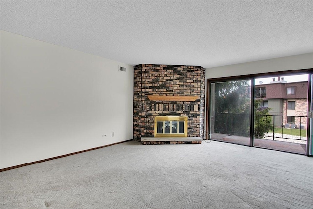 9178 S Rd E Unit D, Palos Hills, IL 60465 - unfurnished living room with carpet flooring, a textured ceiling, and a fireplace
