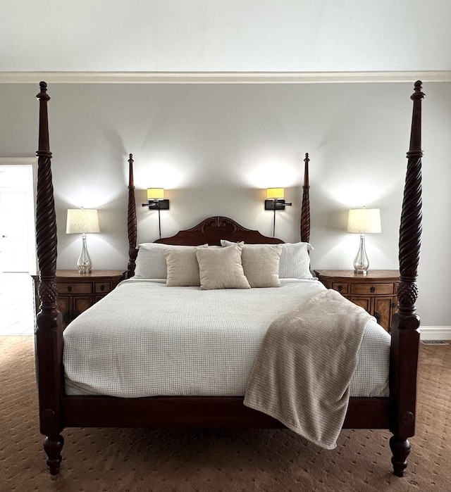 bedroom with baseboards and carpet