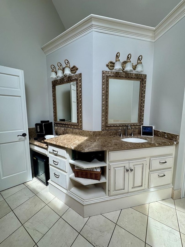 bathroom featuring crown molding and vanity