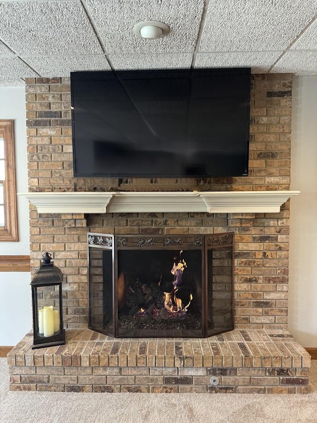 interior details with a brick fireplace