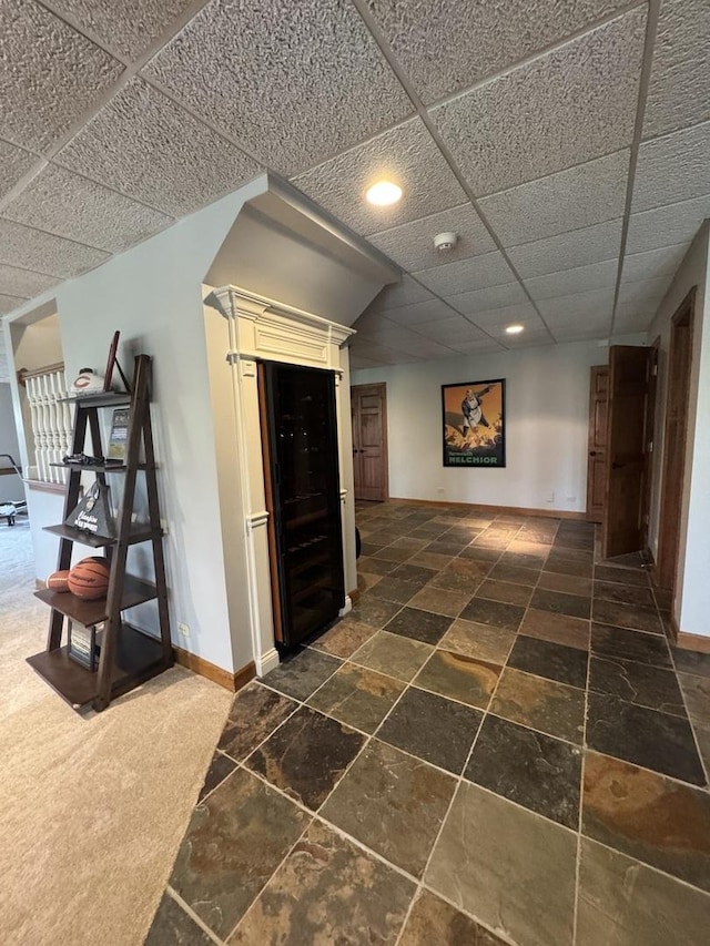 3009 Fox Glen Ct, Saint Charles, IL 60174 - corridor featuring a paneled ceiling, stone tile floors, baseboards, and recessed lighting