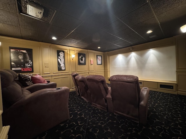 home theater room with recessed lighting, carpet flooring, and a decorative wall