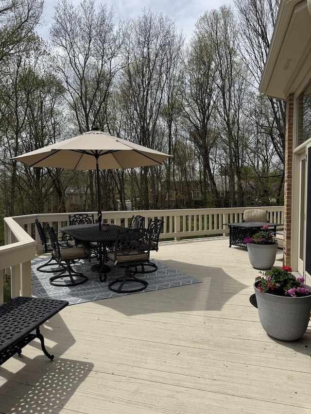 wooden deck with outdoor dining space