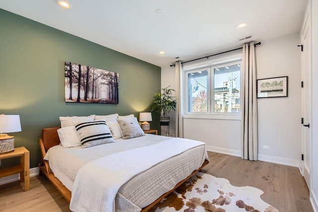 1462 W Winnemac Ave Unit 2, Chicago, IL 60640 - bedroom featuring recessed lighting, baseboards, visible vents, and light wood-style floors