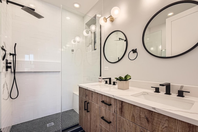 1462 W Winnemac Ave Unit 2, Chicago, IL 60640 - bathroom featuring double vanity, recessed lighting, a sink, and a walk in shower