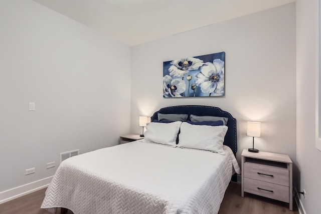 1462 W Winnemac Ave Unit 2, Chicago, IL 60640 - bedroom featuring baseboards, dark wood-style flooring, and visible vents