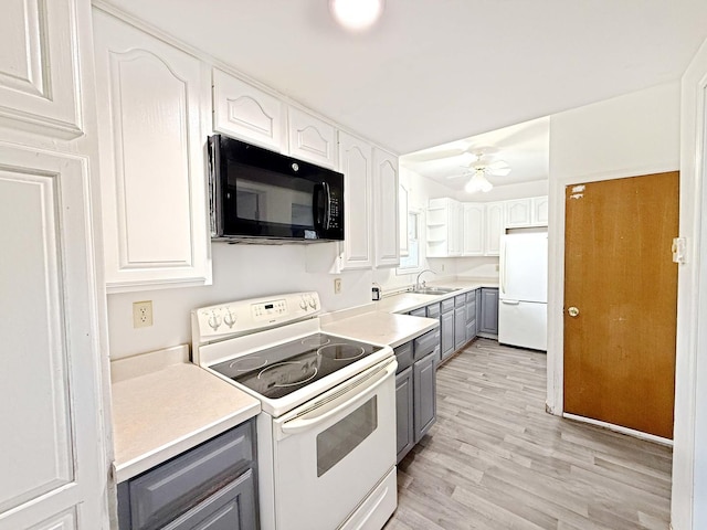 kitchen with a sink, white appliances, ceiling fan, white cabinetry, and gray cabinetry