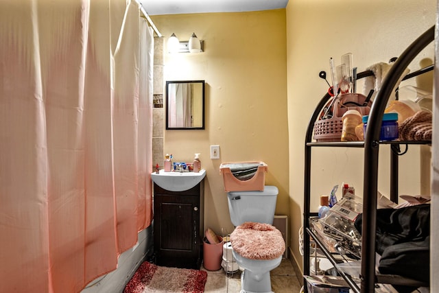 full bath featuring toilet, shower / bath combo, tile patterned flooring, and vanity