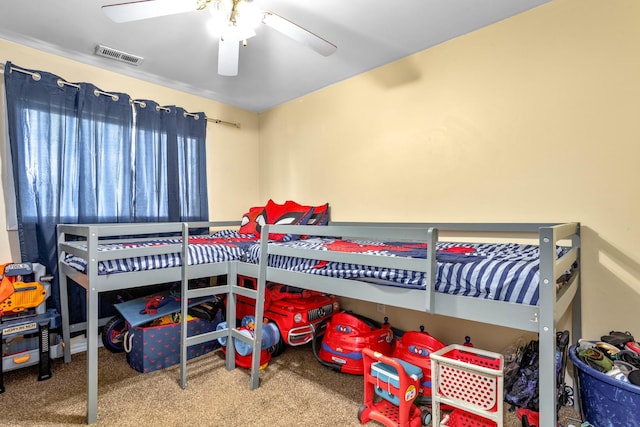 carpeted bedroom featuring visible vents and a ceiling fan