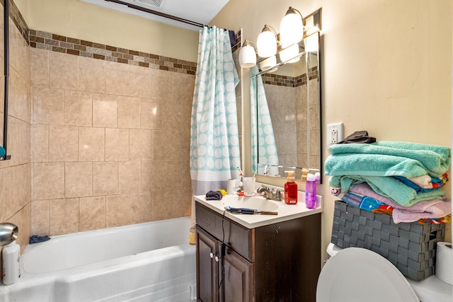 full bathroom featuring vanity, shower / bath combination with curtain, toilet, and visible vents