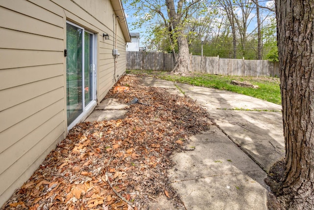 exterior space featuring a patio area and fence
