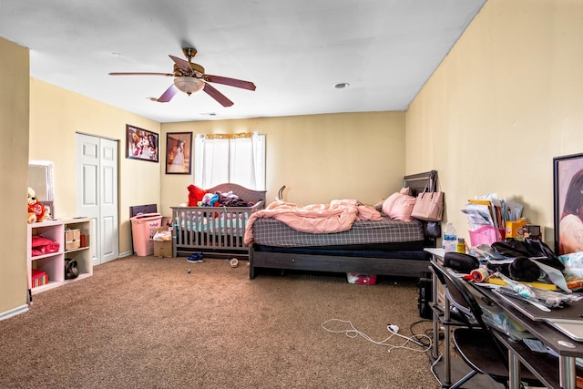 carpeted bedroom featuring a closet and a ceiling fan