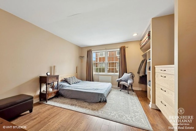 1502 Plymouth Pl Unit 1W, Glenview, IL 60025 - bedroom featuring baseboards and wood finished floors