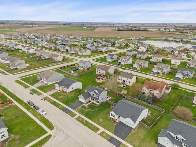 birds eye view of property featuring a residential view and a water view