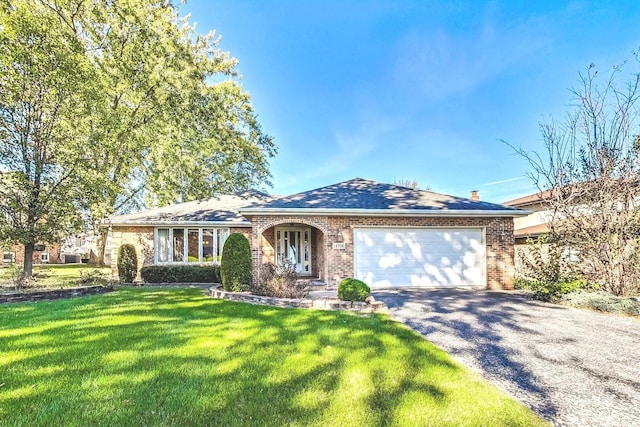 14506 Mallard Dr, Homer Glen, IL 60491 - ranch-style home with a garage, driveway, a front yard, and brick siding