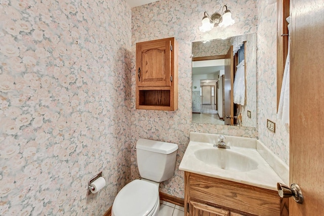 14506 Mallard Dr, Homer Glen, IL 60491 - bathroom featuring wallpapered walls, vanity, baseboards, toilet, and tile patterned flooring
