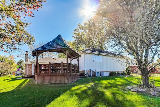 14506 Mallard Dr, Homer Glen, IL 60491 - rear view of house with a chimney, central AC unit, a yard, a wooden deck, and a gazebo