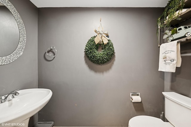 bathroom with a sink and toilet
