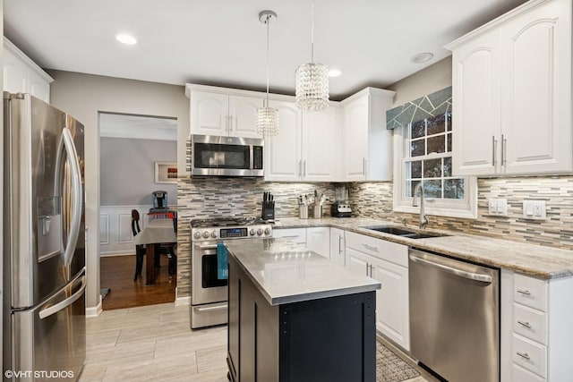 kitchen featuring a sink, white cabinetry, and stainless steel appliances