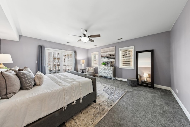 carpeted bedroom featuring baseboards, a ceiling fan, and visible vents